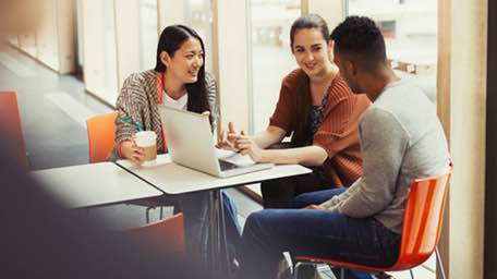 A group of people discussing the ease of fund transfers with Citi