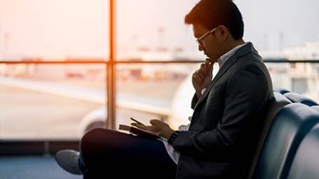 A Citi user transferring funds globally from his mobile phone.